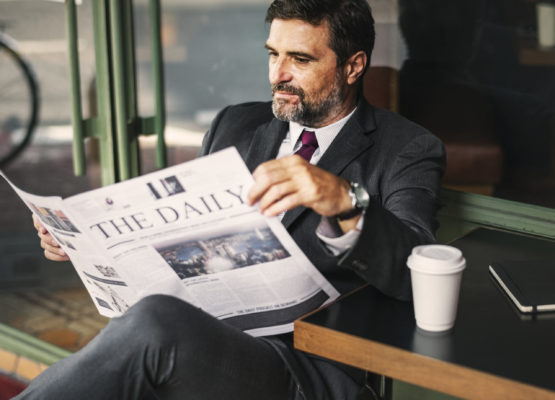 Businessman reading the daily news